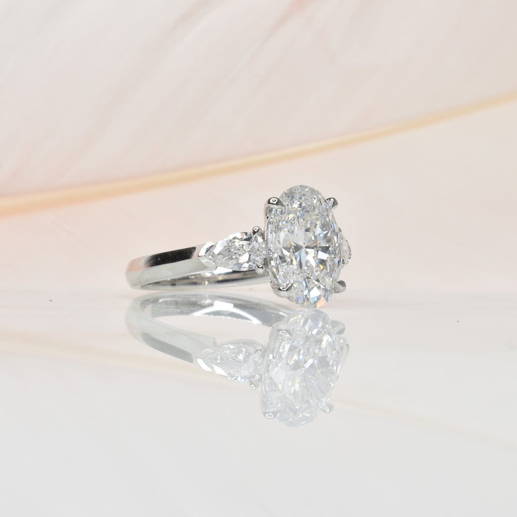 2.5ct Oval Shape Lab Grown Diamond Trilogy Ring with Pear