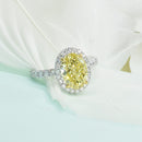 Fancy Intense Yellow Oval Diamond Ring with Halo