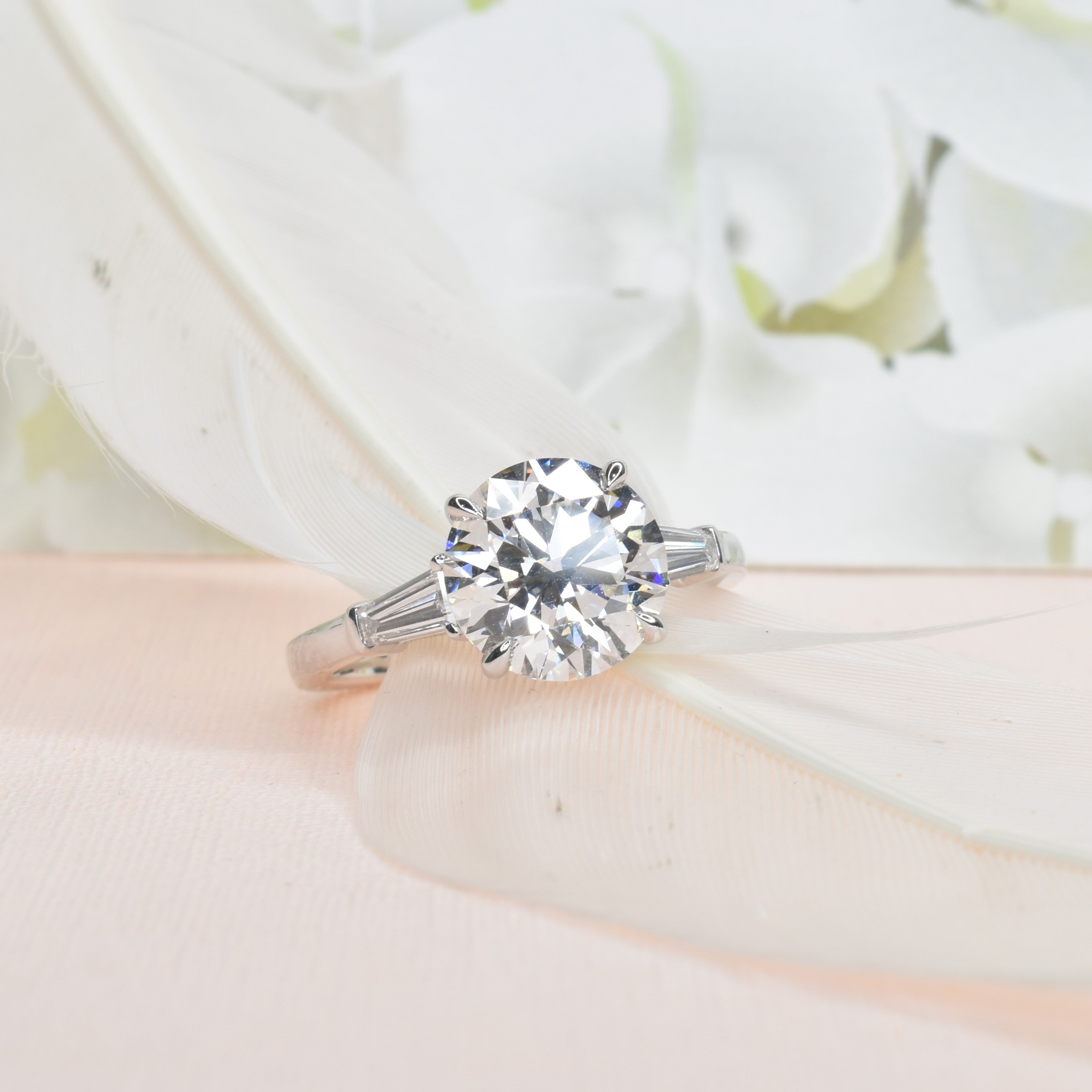 Round Brilliant Trilogy Ring with Tapers
