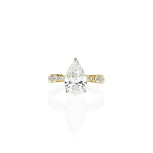 Pear Shaped Diamond Engagement Ring with a Graduated Band