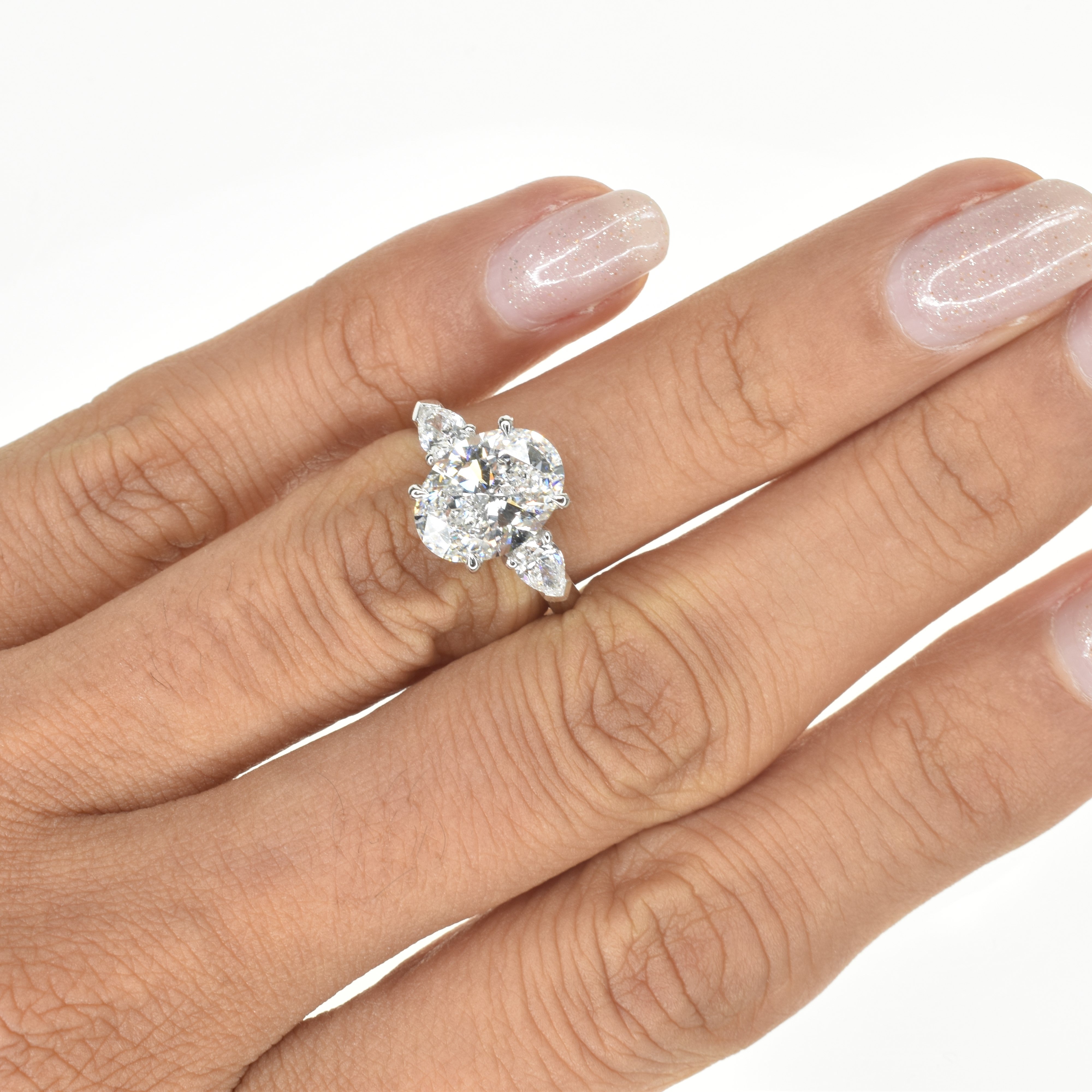 Oval Trilogy Ring With Pear Diamonds