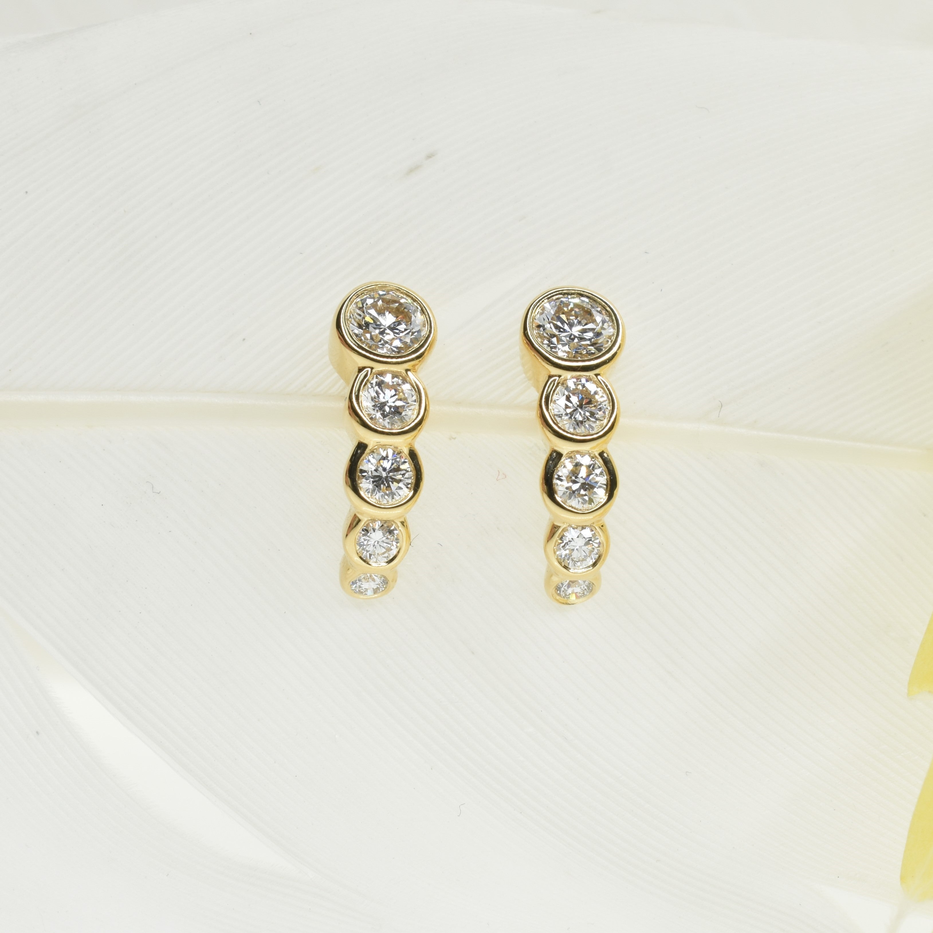 Graduated Bezel Set Diamond Hoops