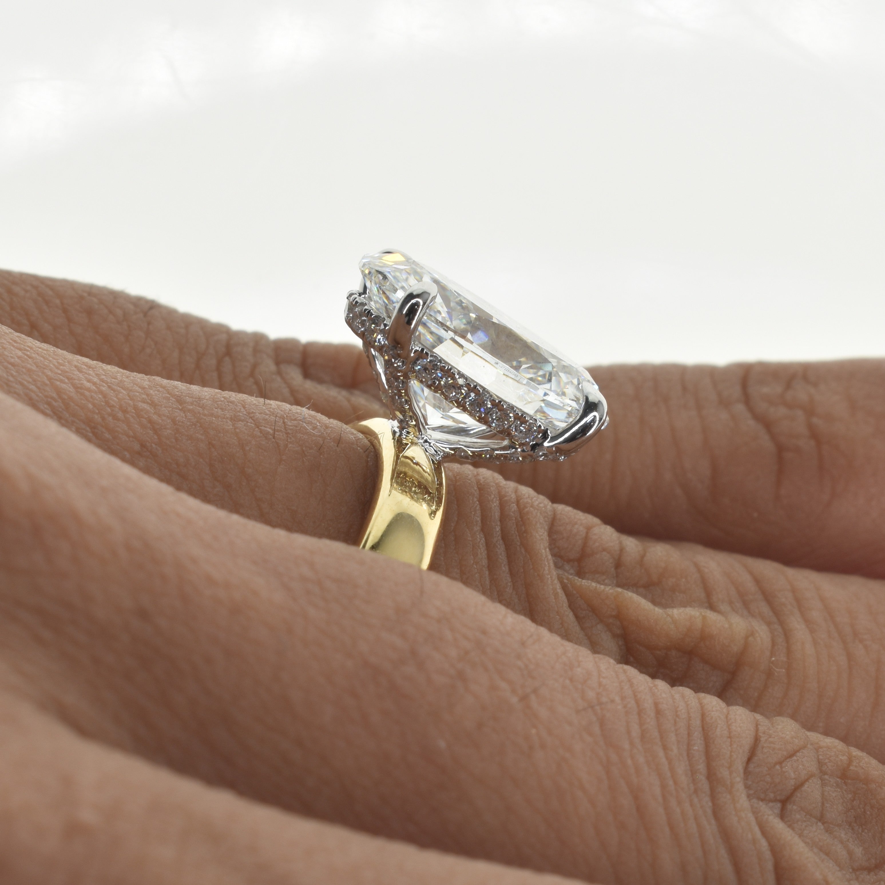 4ct Oval Shape Lab Grown Diamond Engagement Ring in a wide band and underhalo setting