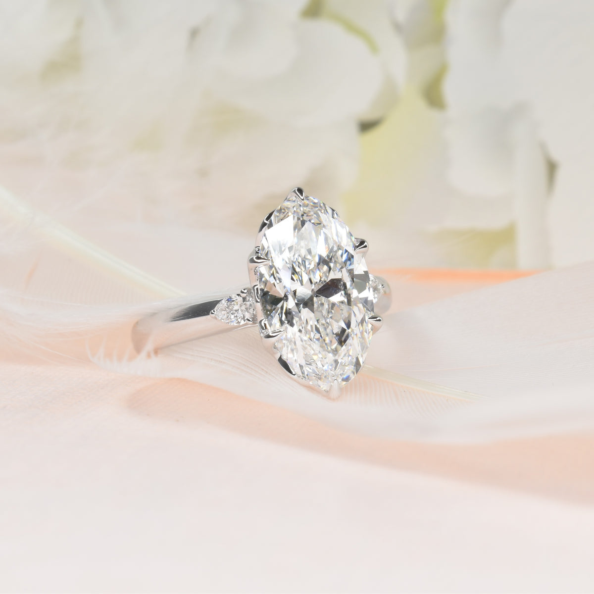 3ct Moval Trilogy Engagment Ring with Pear Shapes