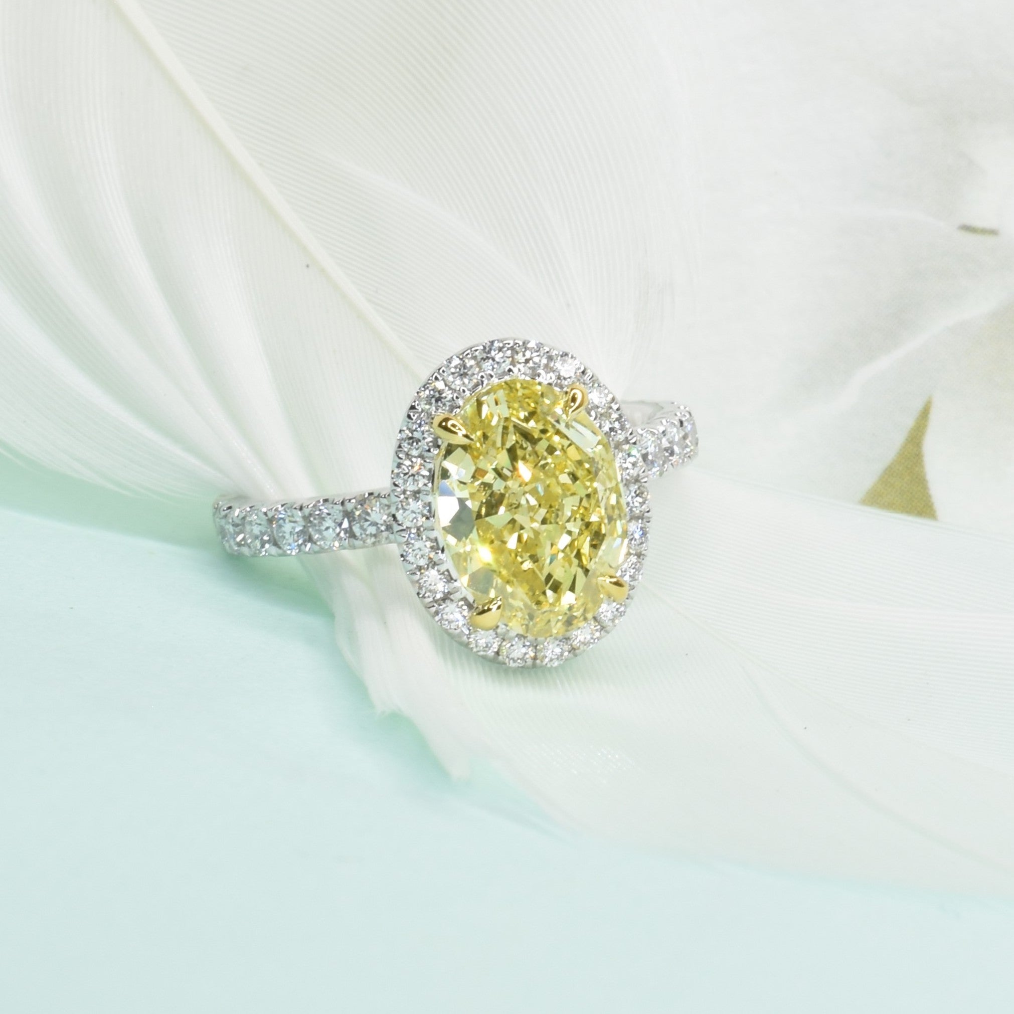 Fancy Intense Yellow Oval Diamond Ring with Halo