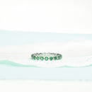 Emerald Shared Prong Eternity Band