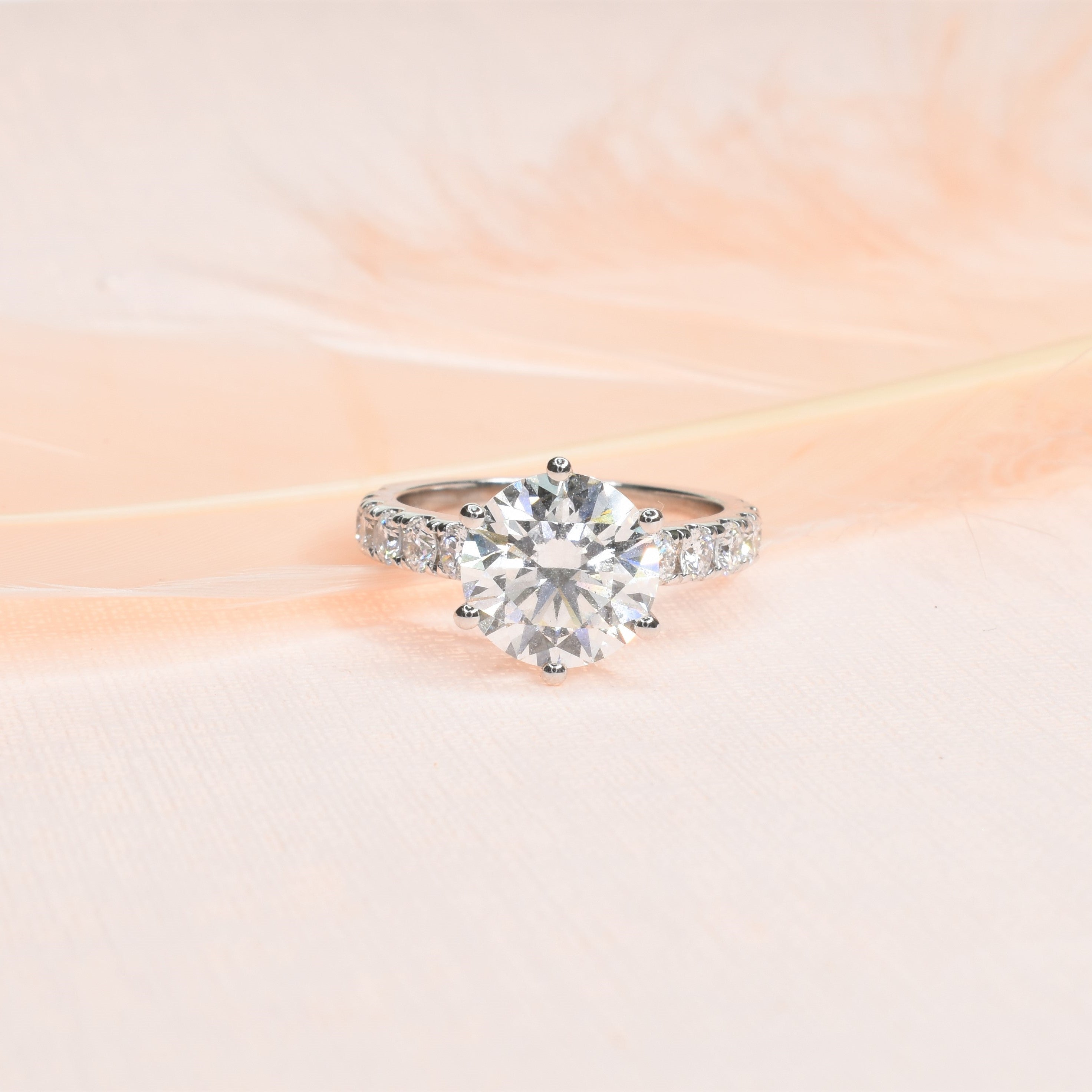 Round Brilliant Diamond with a Pave Diamond Band