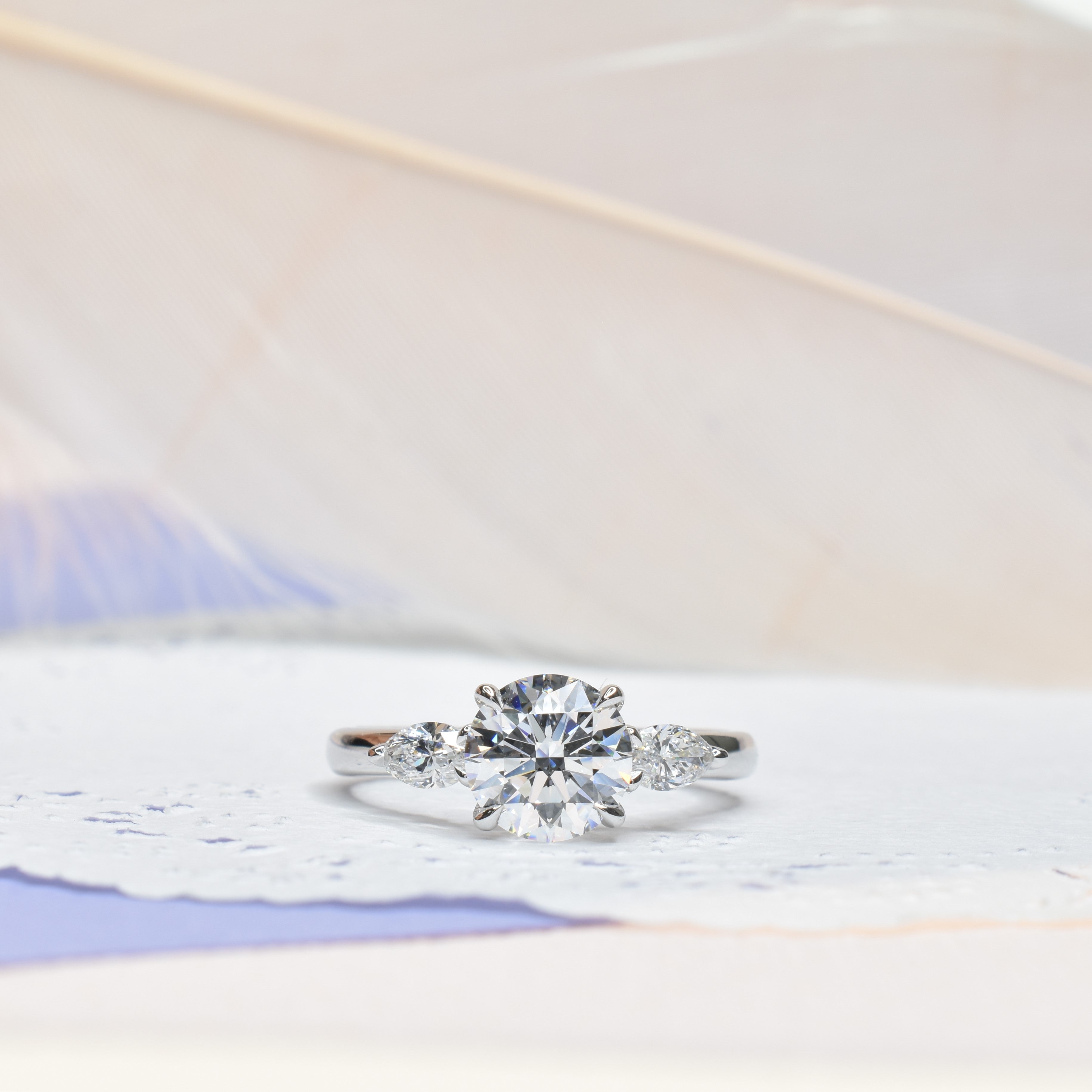 Classic Round Diamond Engagement ring with Marquise Side Diamonds