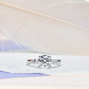 Classic Round Diamond Engagement ring with Marquise Side Diamonds