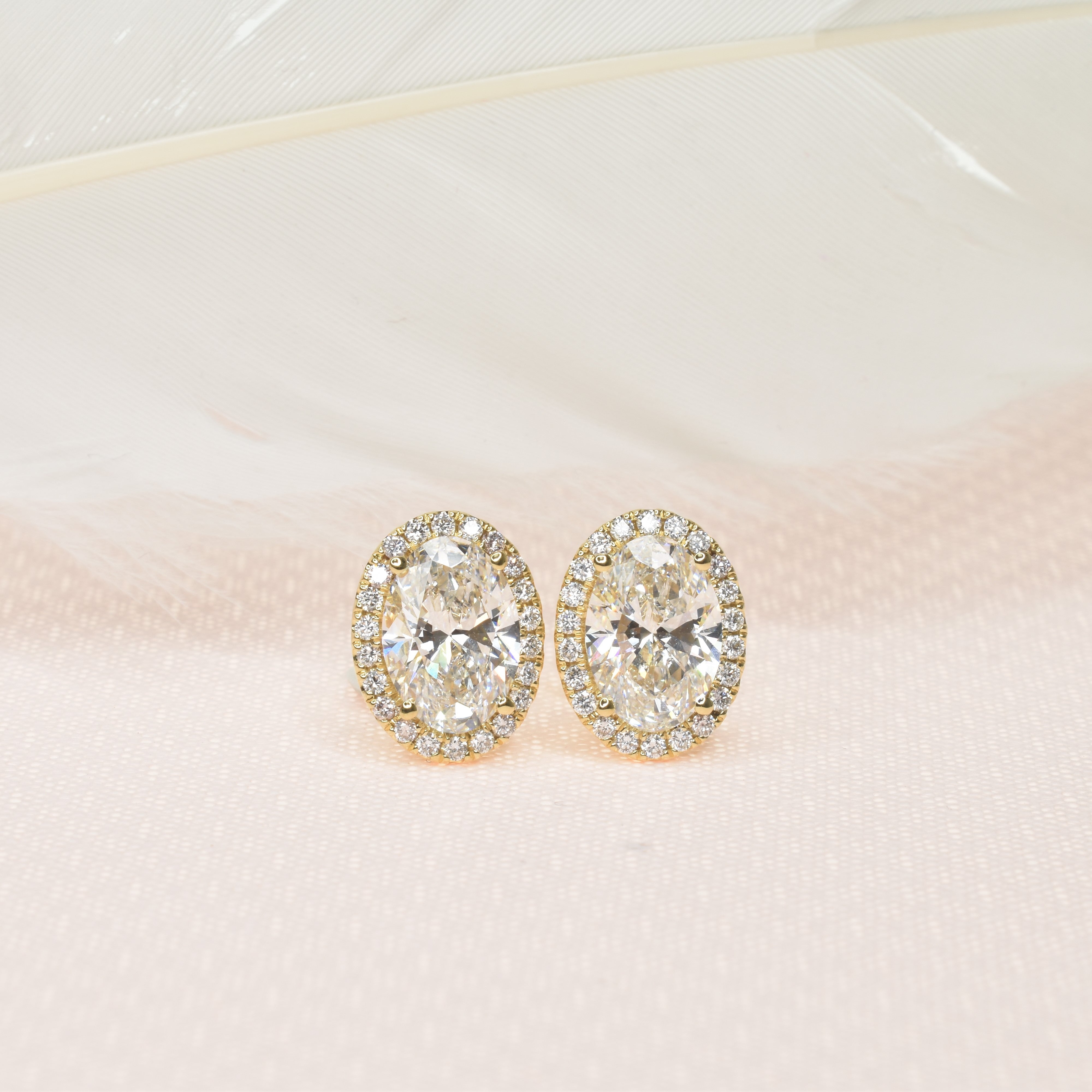 Oval Shaped Diamond Earrings with Halo
