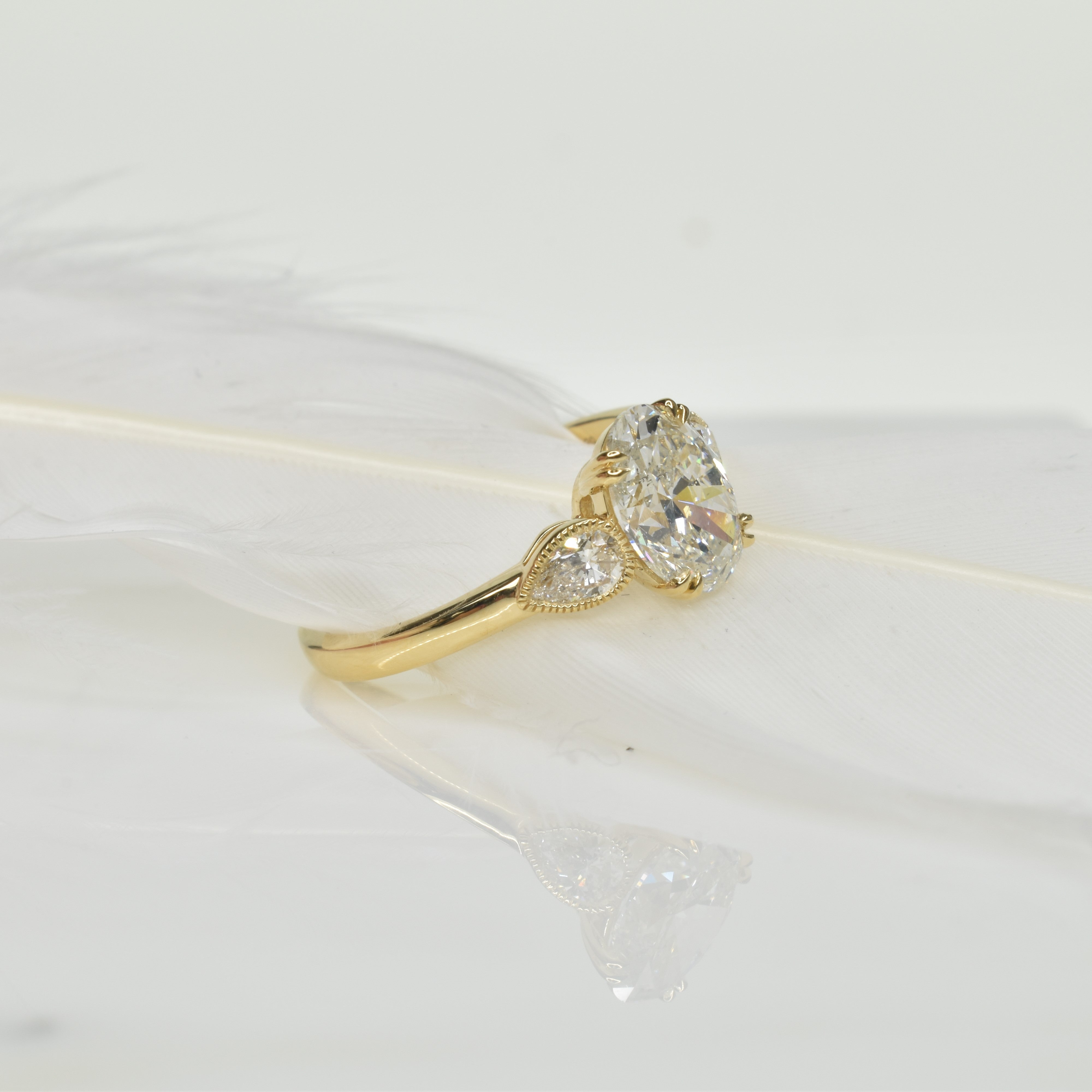 Oval Diamond Ring with Pear Diamonds on Shoulder