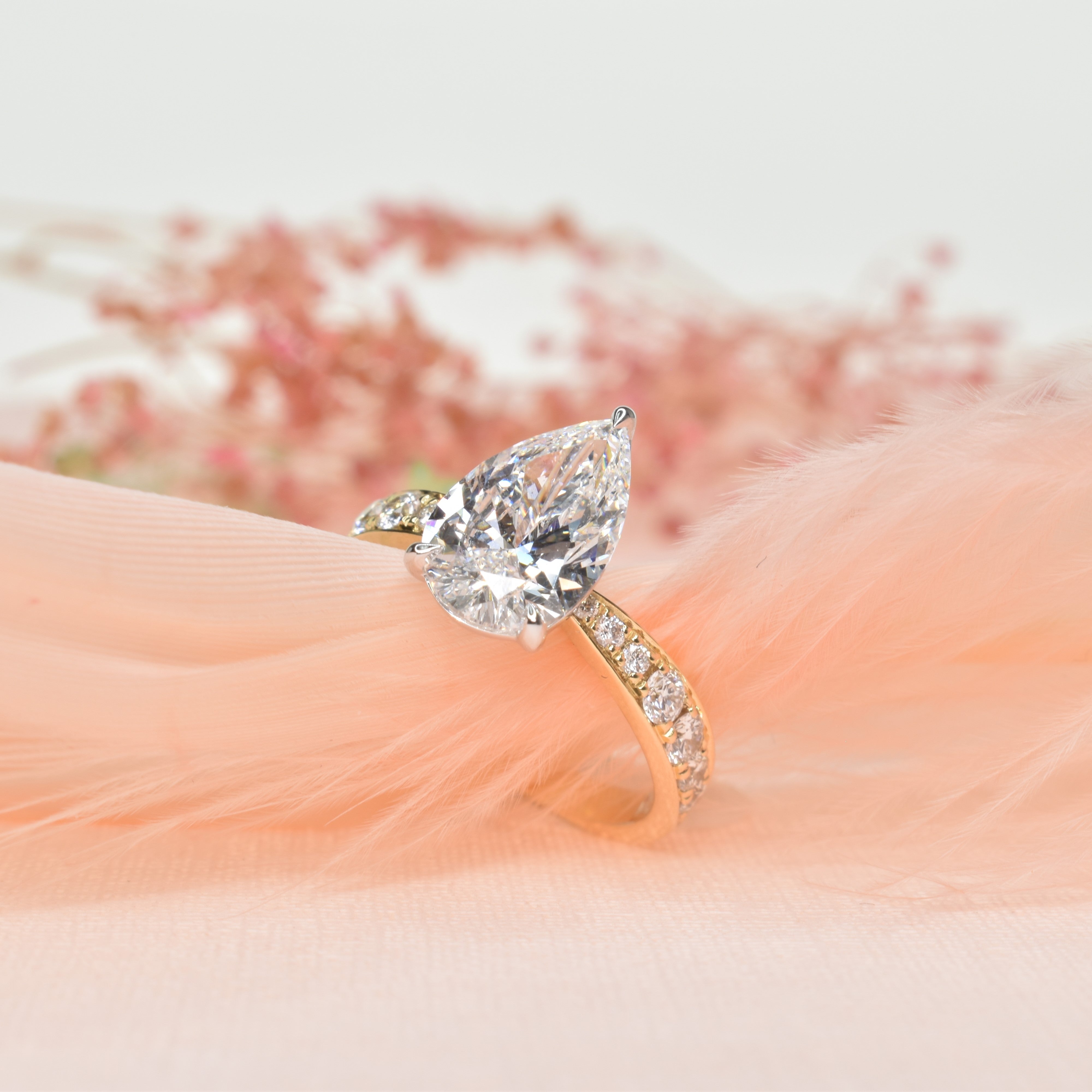 Pear Shaped Diamond Engagement Ring with a Graduated Band